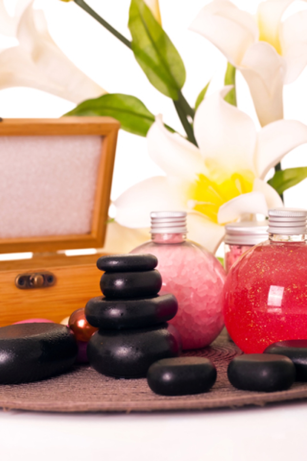 Hot stones and bath bottles with lily