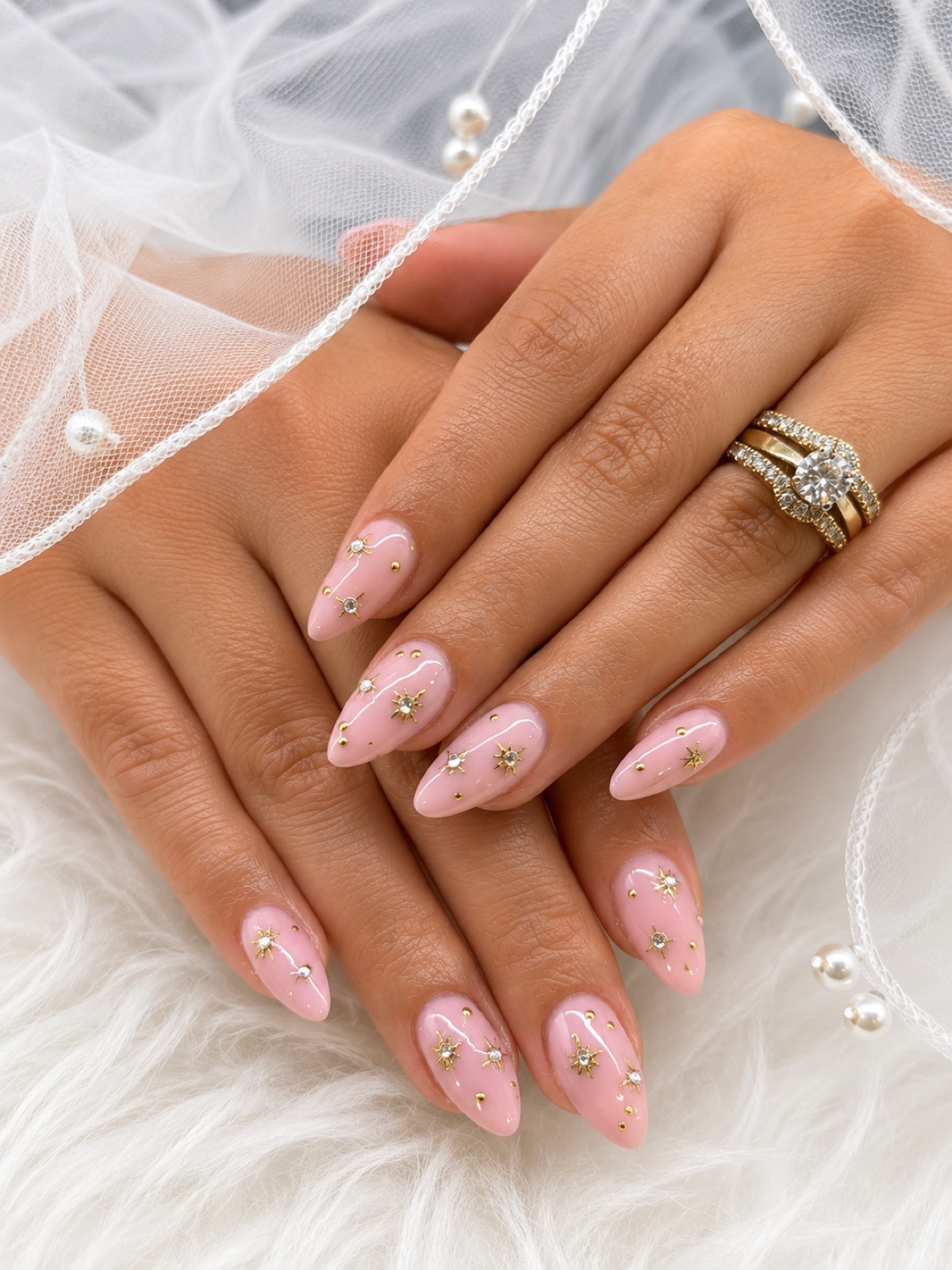 Bridal pink manicure with gold star detail